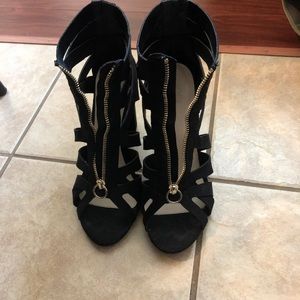 Black suade high heels with gold zipper